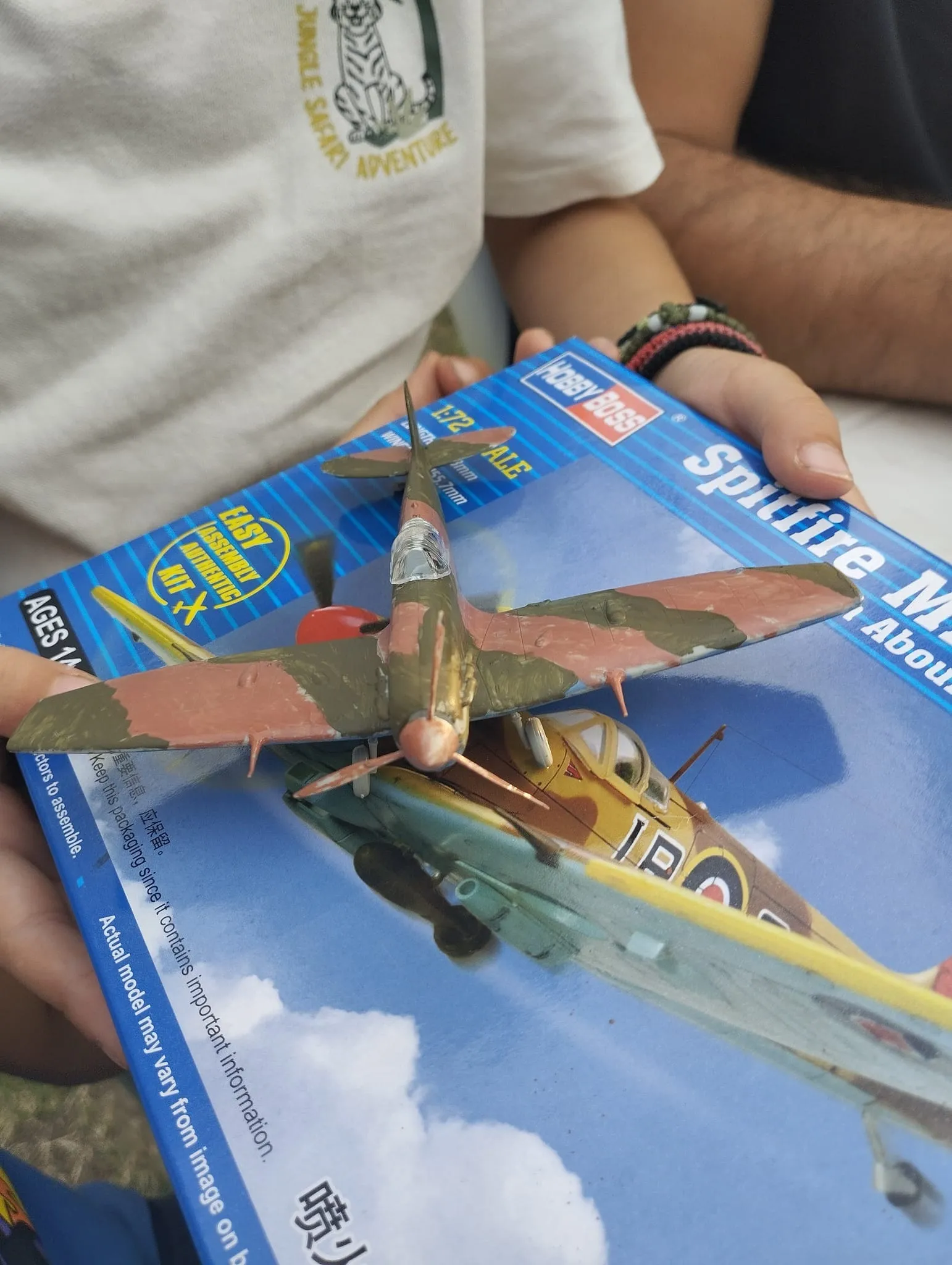 Kids making plastic airplane models